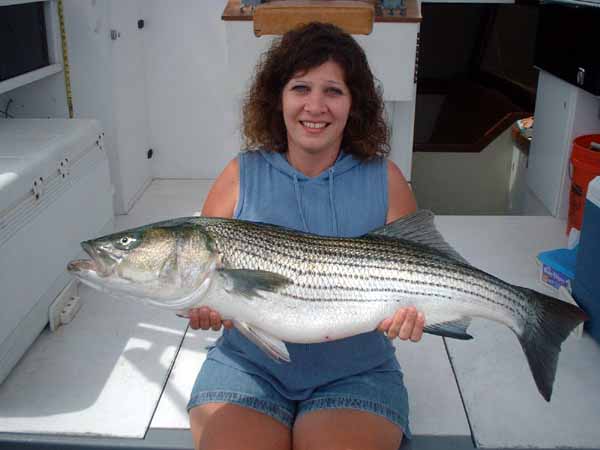 Gina is straining to hold this striper up for the photo.